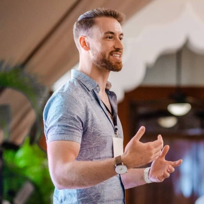 Nicholas Korom speaking at an event